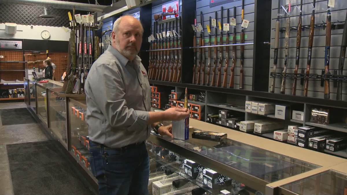 Calgary gun store owner shows off some of the ammo that is now illegal in Canada