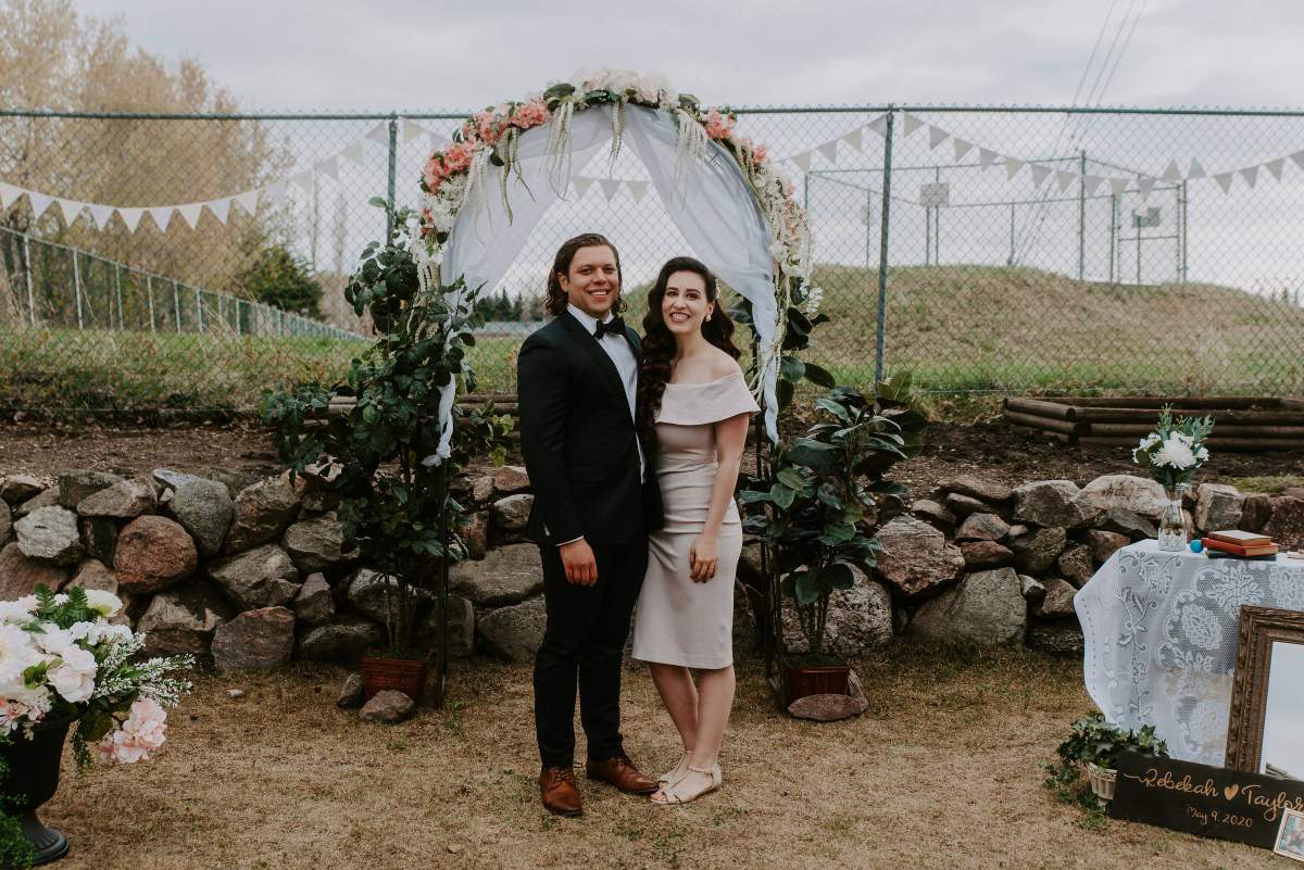 Taylor Fawcett and Rebekah Andrews swapped their 170 person July wedding for an intimate backyard ceremony on Saturday.