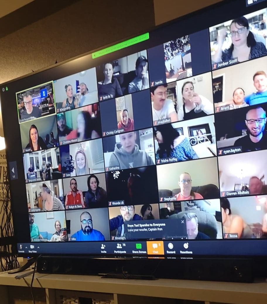 A screen showing people participating via the Zoom video chat app. 

