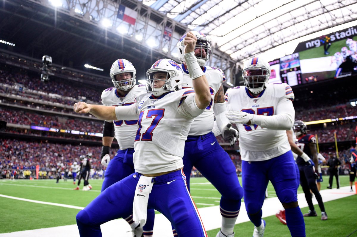Buffalo Bills quarterback Josh Allen (17) celebrates after catching a pass for a touchdown against the Houston Texans during the first half of an NFL wild-card playoff football game Saturday, Jan. 4, 2020, in Houston.