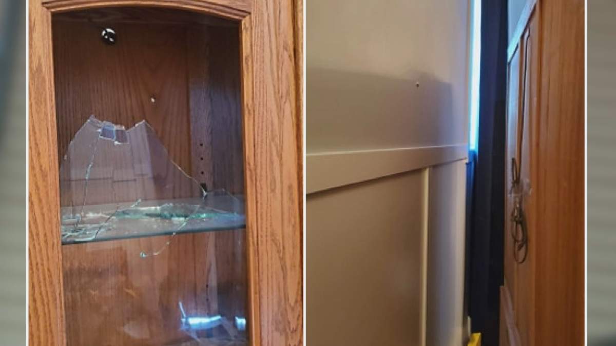A bullet came from outside and went through a china cabinet and wedged itself into the wall.