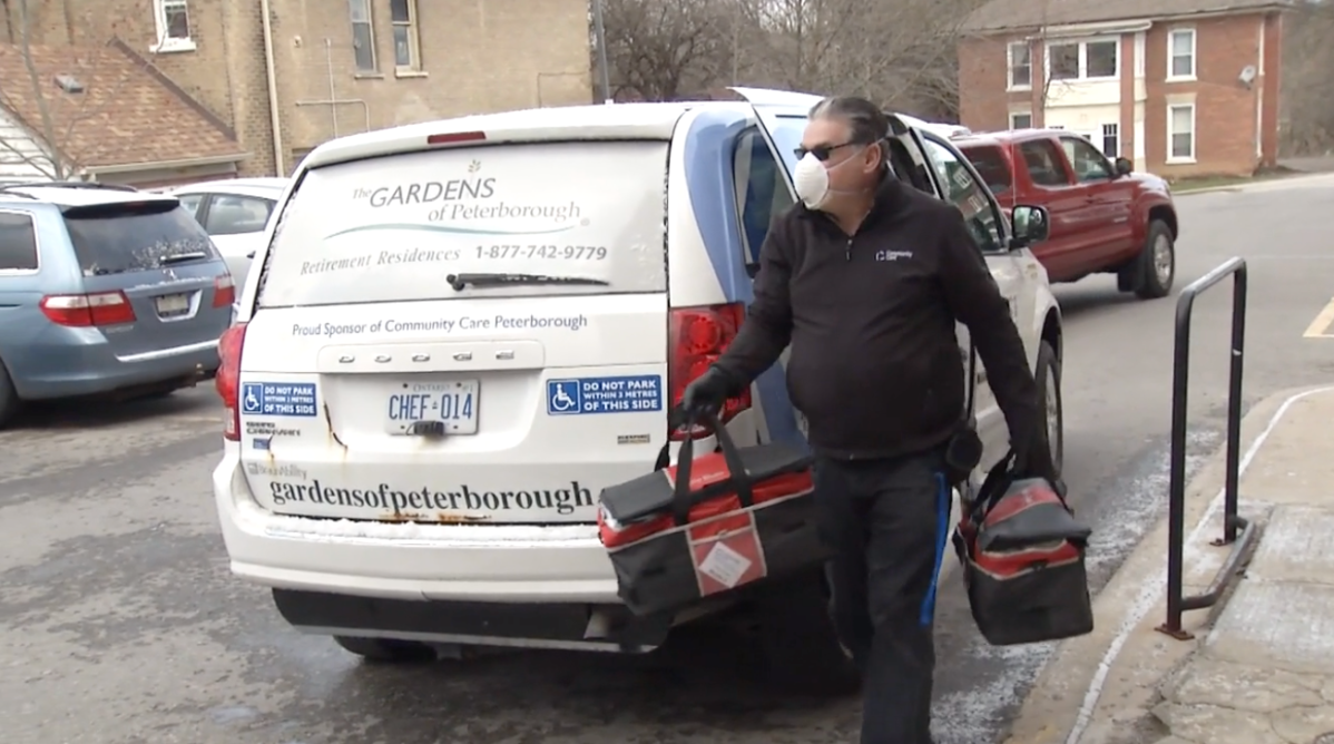 A Community Care Peterborough volunteer delivers meals to seniors on April 16, 2020.