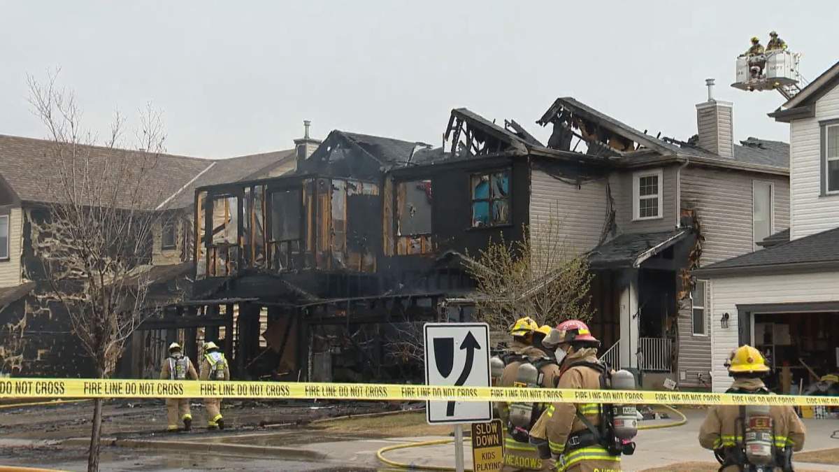 Fire damaged homes in southeast Calgary on Sunday, May 3, 2020.