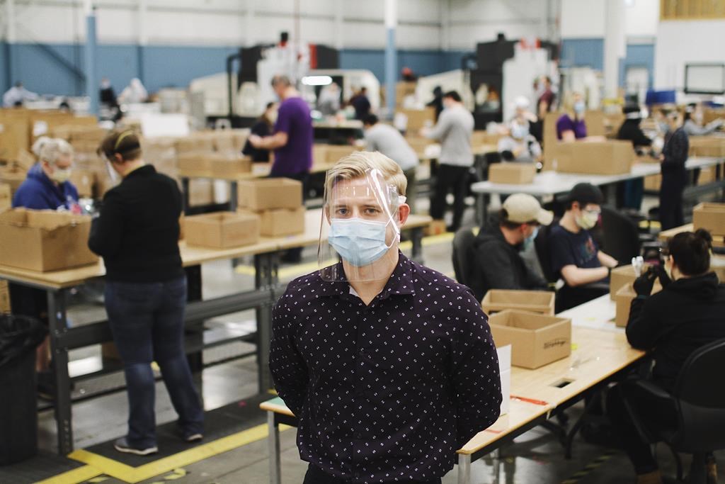 Jeremy Hedges, founder oand CEO of InkSmith and its spin-off Canadian Shield, poses for a photo on the floor of his company's new factory in Waterloo, Ont.