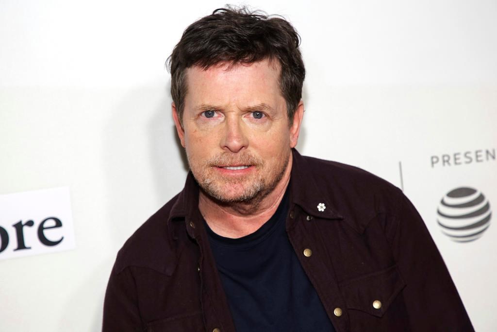 Actor Michael J. Fox attends the 2019 Tribeca Film Festival at the Tribeca Performing Arts Center, Tuesday, April 30, 2019, in New York. Michael J. Fox's research foundation is launching a podcast to help people with Parkinson's disease navigate the COVID-19 pandemic. THE CANADIAN PRESS/Brent N. Clarke/Invision/AP.