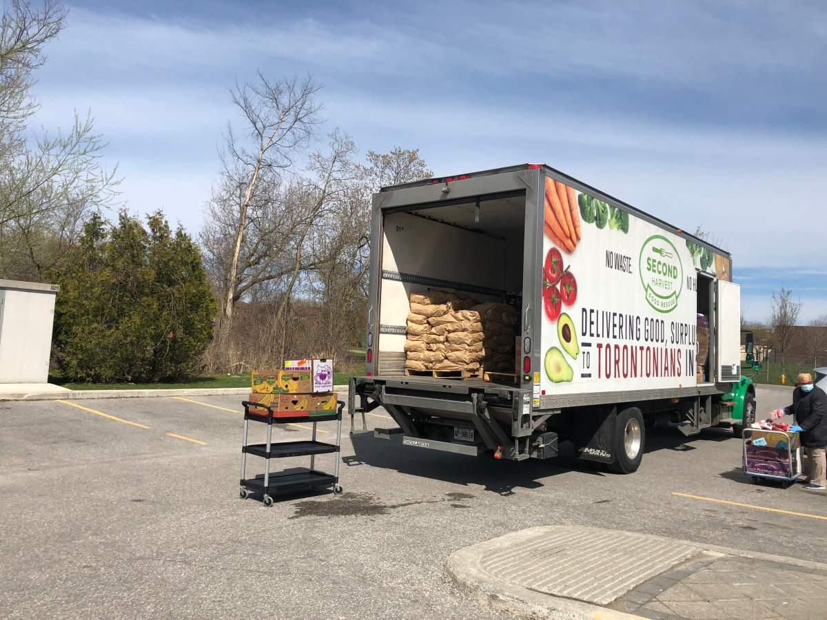 A Second Harvest truck and driver deliver food to the Boys and Girls Club of East Scarborough.