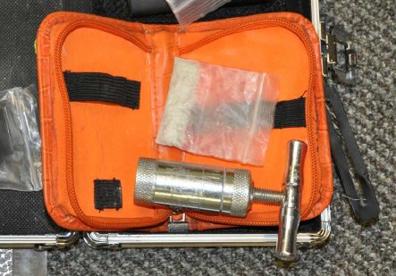 Police seized a large quantity of drugs and an explosive device, and a drug press, seen in this photo, from a Brockville man this week.