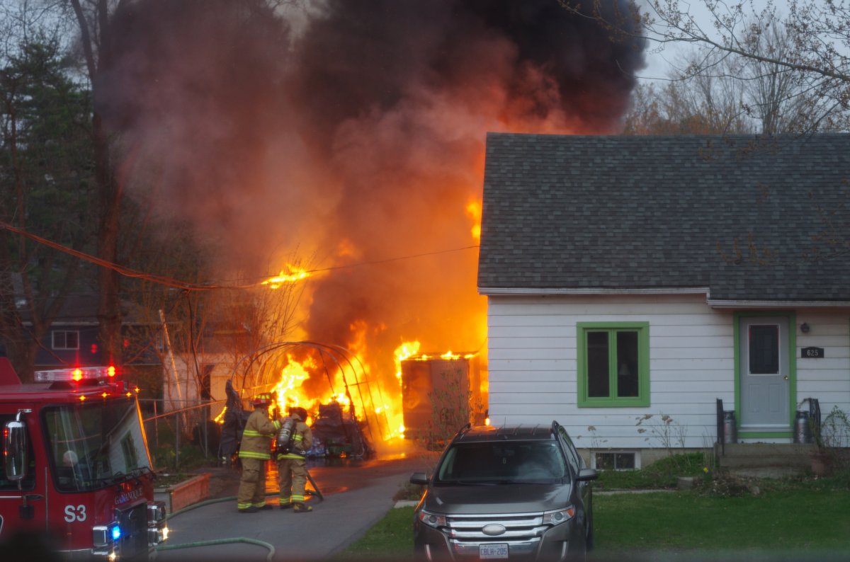 Gananoque fire crews work to put out an extensive garage fire in the city's west end.