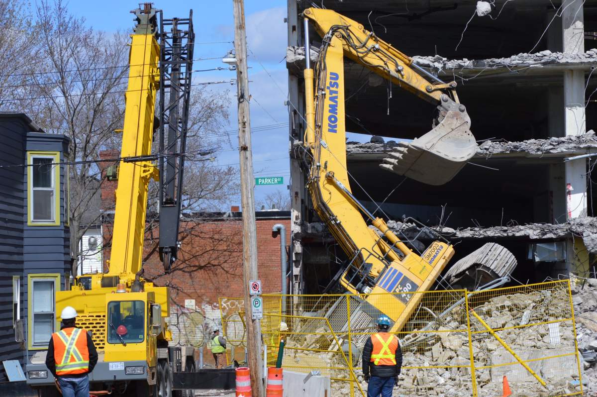 Nova Scotia's Department of Labour is investigating after an excavator tipped over at a construction site on Quinpool Road in Halifax.