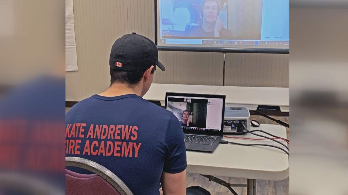 Coaldale Fire Chief Kevin McKeown goes through medical scenarios online with a Kate Andrews High School Fire Academy student.