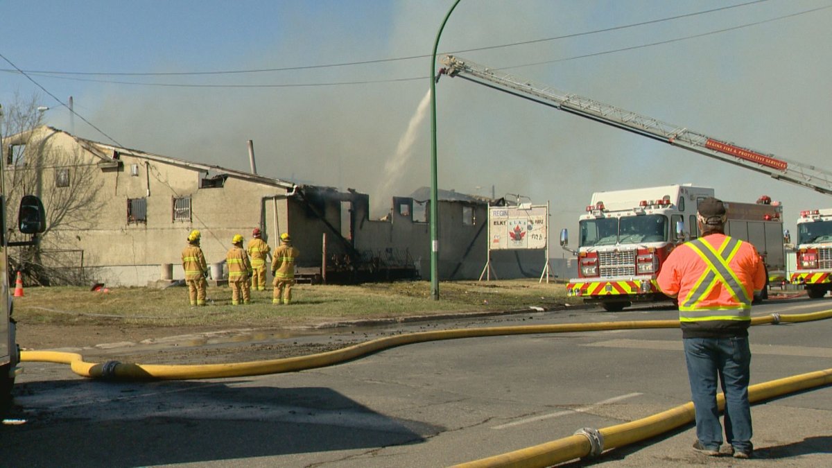 The Regina Fire Department respond to a fire that gutted the building used by the Regina Elks. President of the Regina Elks, Eugene Wilson, looks at the building as firefighters tackle the blaze.