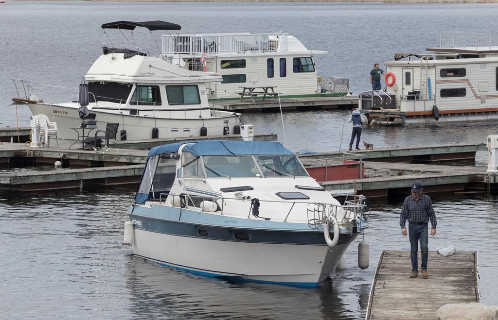 Boats get launched at Kawartha Lakes Marina in Bobcaygeon, Ont. on Saturday, May 16, 2020. THE CANADIAN PRESS/Fred Thornhill.