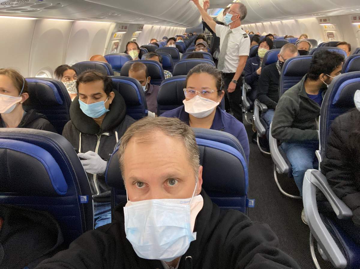 University of San Francisco scientist Ethan Weiss posted a photo of a packed United Airlines flight on Twitter.