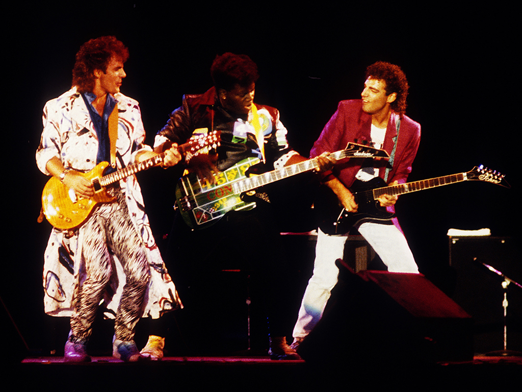 (L-R) Jonathan Cain, Randy Jackson and Neal Schon performing with Journey at the Calaveras County Fairgounds in Jackson, Calif. on Aug. 23, 1986.