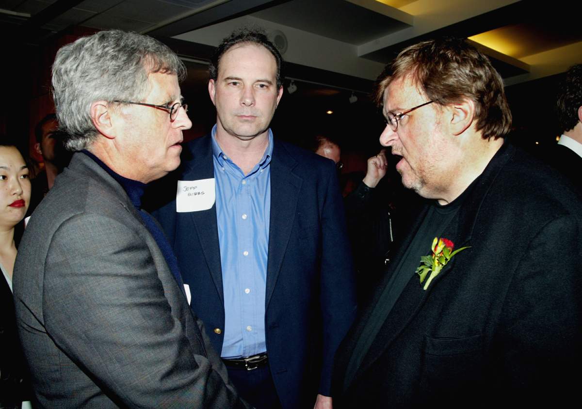 Filmmaker Michael Moore (R) talks to Jeff Gibbs (L) and filmmaker Ed Gaffney at The International Documentary Association 21st annual celebration in honour of the Academy Awards documentary nominees held at the Academy of Motion Pictures Arts and Sciences on March 19, 2003, in Beverly Hills, Calif.