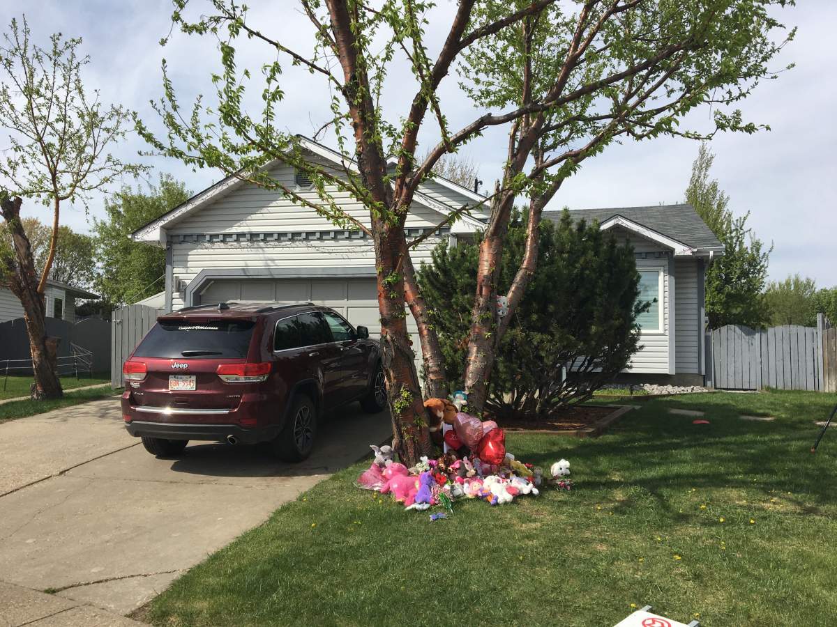 Neighbours have started a memorial for the young girl who died after a stabbing incident in Mill Woods on Monday, May 18, 2020.