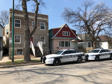 Winnipeg Police outside of the Redwood Avenue apartment where a woman was assaulted and later died. 