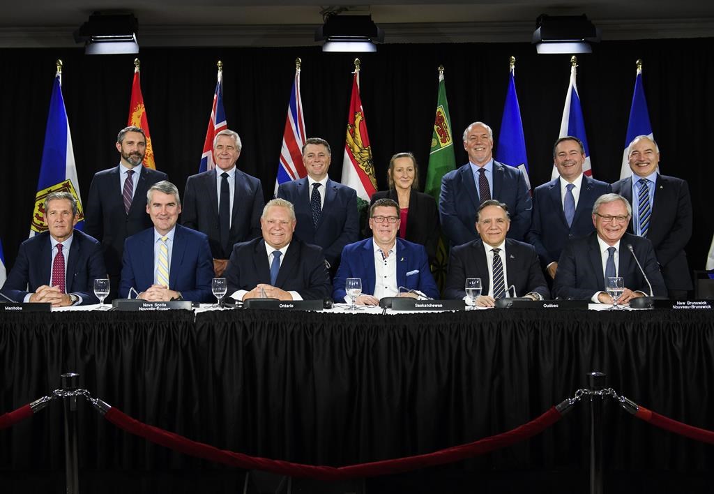 Canadian Premiers pose for a photo after speaking to the media during a meeting of the Council of the Federation, which comprises all 13 provincial and territorial leaders, in Mississauga, Ont., on December 2, 2019. Quebec is postponing the Council of the Federation meeting it was set to host this summer until the fall.