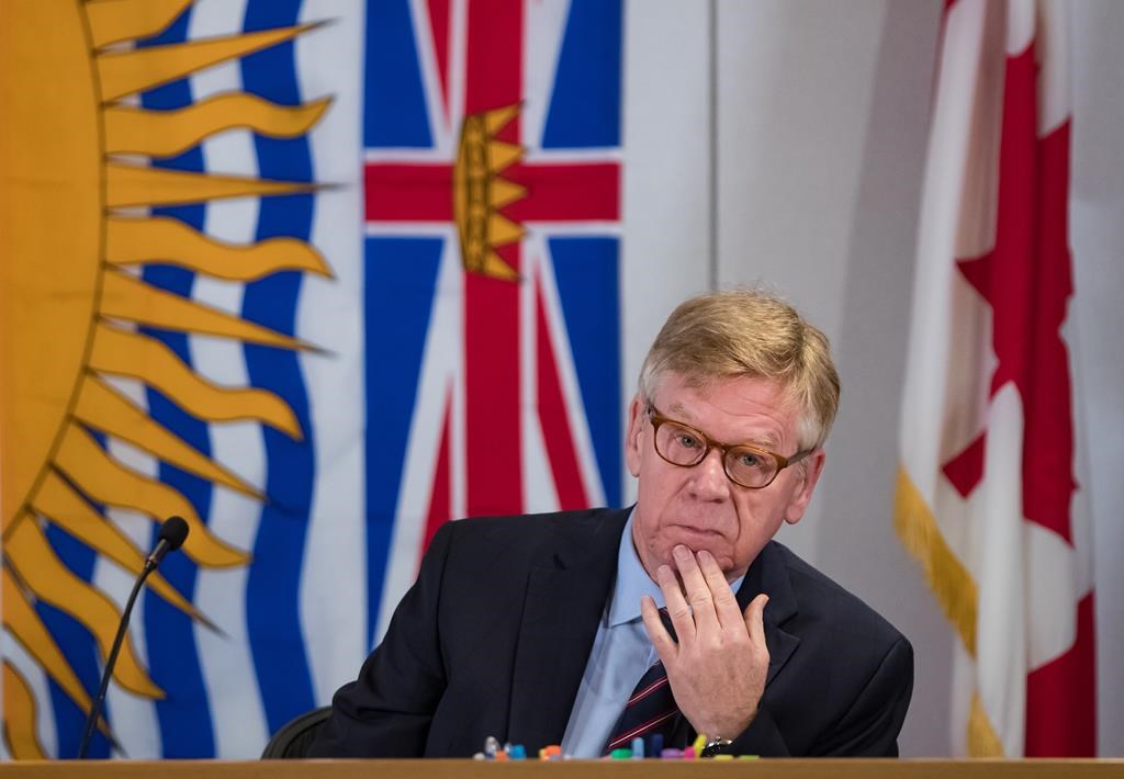Commissioner Austin Cullen listens to introductions before opening statements at the Cullen Commission of Inquiry into Money Laundering in British Columbia, in Vancouver, on Feb. 24, 2020.