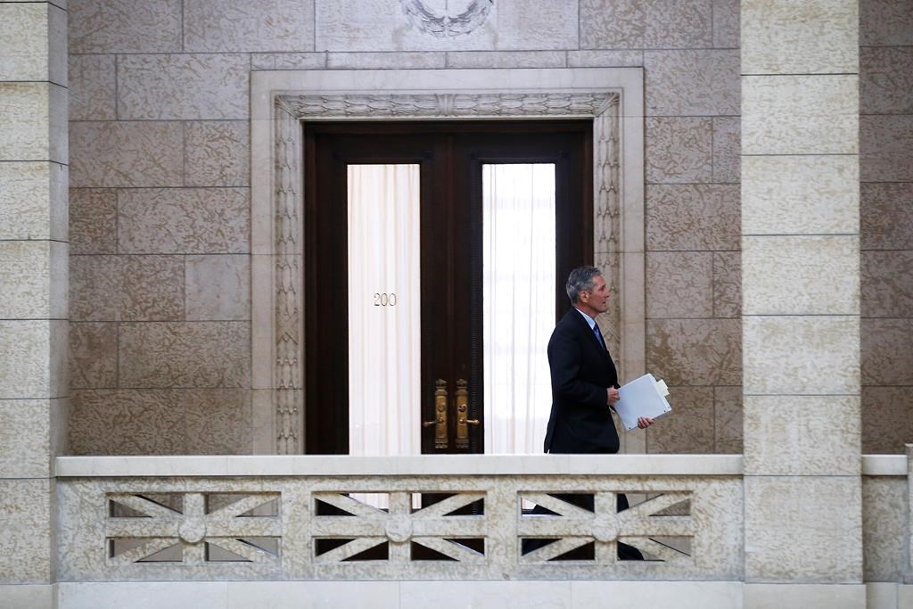 Manitoba premier Brian Pallister makes his way to question period at the Manitoba Legislature in Winnipeg, Wednesday, May 13, 2020. THE CANADIAN PRESS/John Woods.