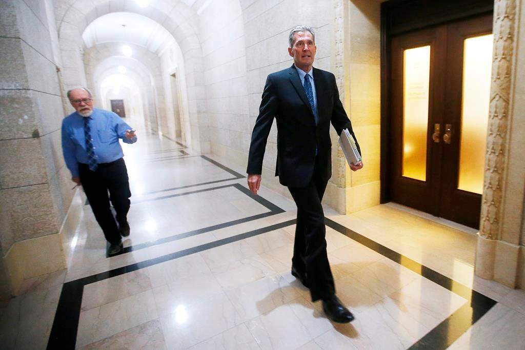Manitoba Premier Brian Pallister does not respond to a reporter's question as he makes his way to question period at the Manitoba Legislature in Winnipeg, Wednesday, May 13, 2020.