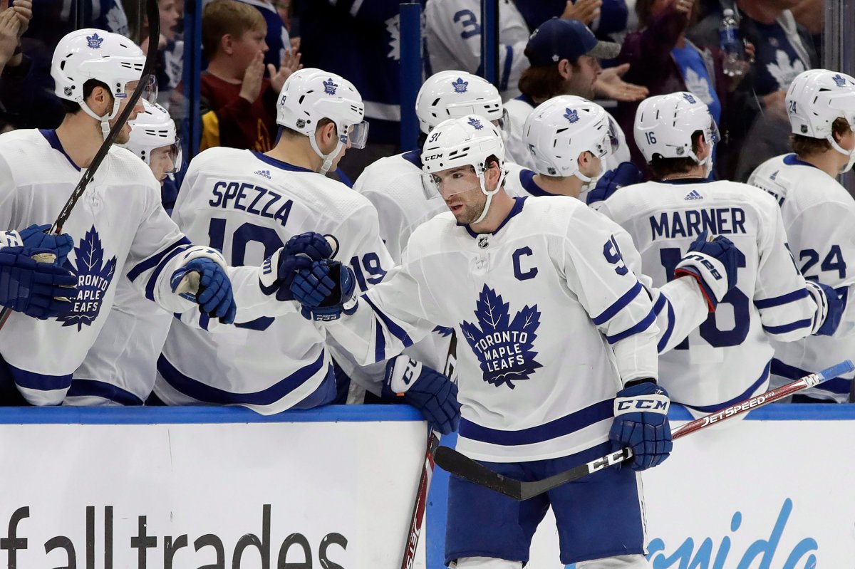 Toronto Maple Leafs centre John Tavares (91) celebrates with the bench after his goal against the Tampa Bay Lightning during the second period of an NHL hockey game Tuesday, Feb. 25, 2020, in Tampa, Fla.