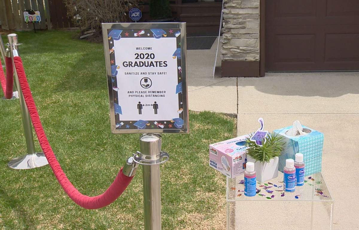 Signs, gloves and sanitizer were present as Calgary high school grads celebrated on Monday, May 18, 2020, amid the COVID-19 pandemic.