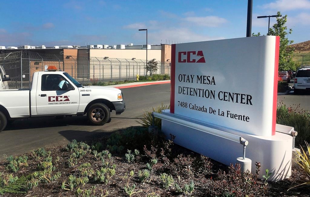 FILE - In this June 9, 2017, file photo, a vehicle drives into the Otay Mesa Detention Center in San Diego. Authorities say a 57-year-old person in immigration custody has died from complications related to the coronavirus, marking the first reported death from the virus among about 30,000 people in U.S. immigration custody.
