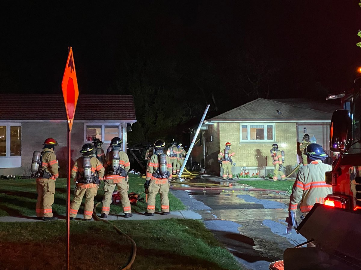 The fire department says a garage fire on Wavell Street in London, Ont., on Monday night spread to two neighbouring homes. 