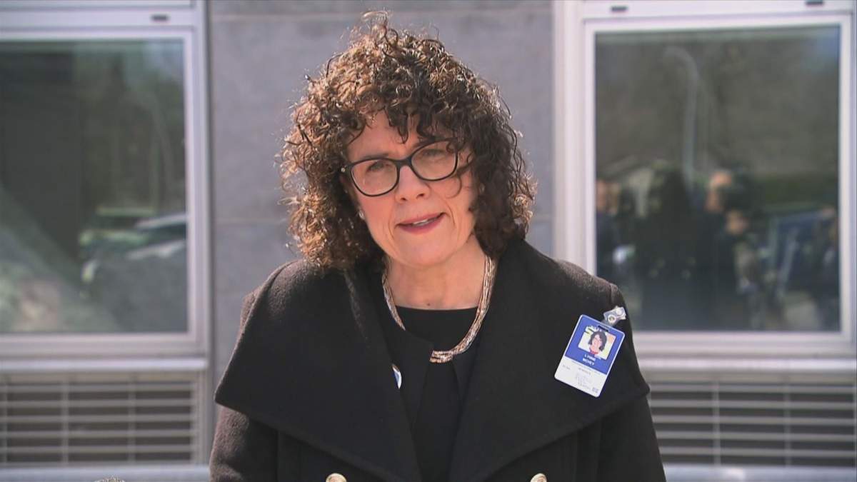 Lynne McVey speaks outside the Herron residence after the regional health authority took over its operations six weeks ago. Tuesday, May 26, 2020.
