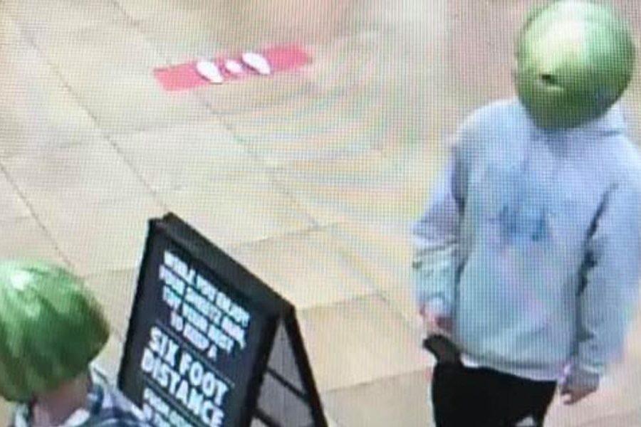 Two suspects with watermelons on their heads are shown at a Sheets convenience store in Louisa, Va., on May 6, 2020.