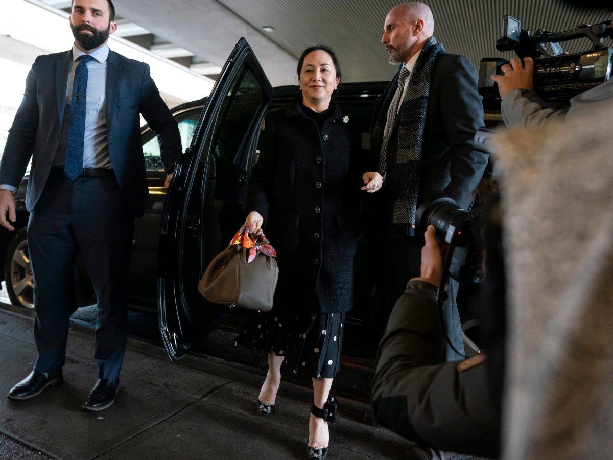 Meng Wanzhou steps out of her car upon arriving at B.C. Supreme Court in Vancouver, British Columbia, Canada 20 January 2020. 