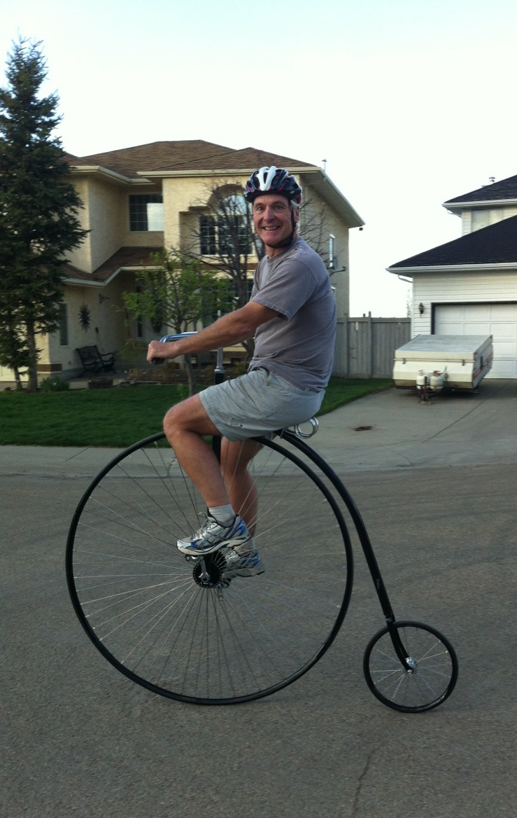 Doug Mitchell on a Penny Farthing bike in 2013