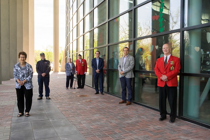 Delegates and RCMP veterans along with their wives lay the first bricks down on the “Pillars of the Force” memorial site at the RCMP Heritage Centre in Regina, Sask., May 23, 2020.