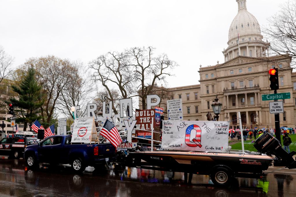 Demonstrators take part in an “American Patriot Rally,” organized on April 30, 2020, by Michigan United for Liberty on the steps of the Michigan State Capitol in Lansing, demanding the reopening of businesses.