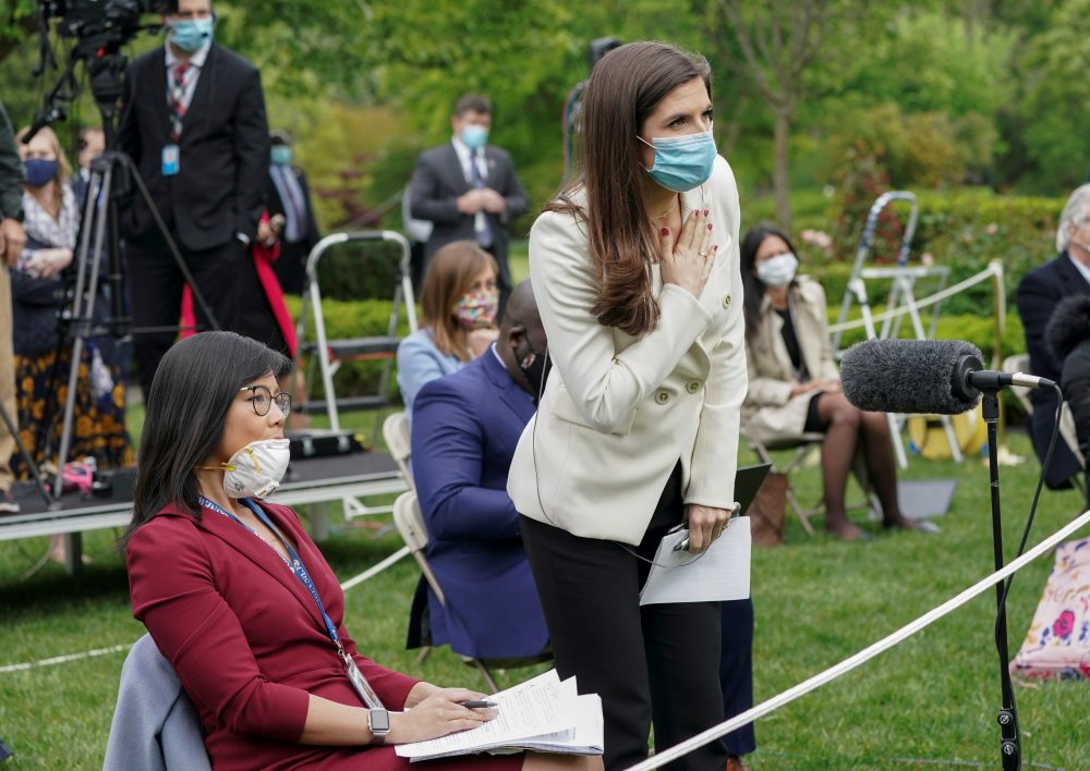 CNN White House correspondent Kaitlan Collins tries to ask her question of U.S. President Donald Trump after he called on her on the heels of an exchange with CBS News correspondent Weijia Jiang, left, during a coronavirus outbreak response briefing at the White House in Washington, U.S., May 11, 2020.