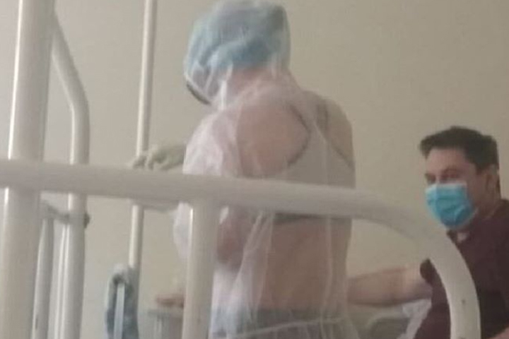 A nurse is shown wearing underwear beneath her PPE at the Tula Regional Clinical Hospital in Russia in May 2020.