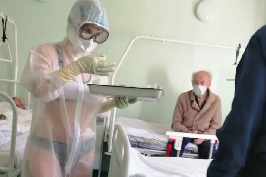 A nurse is shown wearing underwear beneath her PPE at the Tula Regional Clinical Hospital in Russia in May 2020.