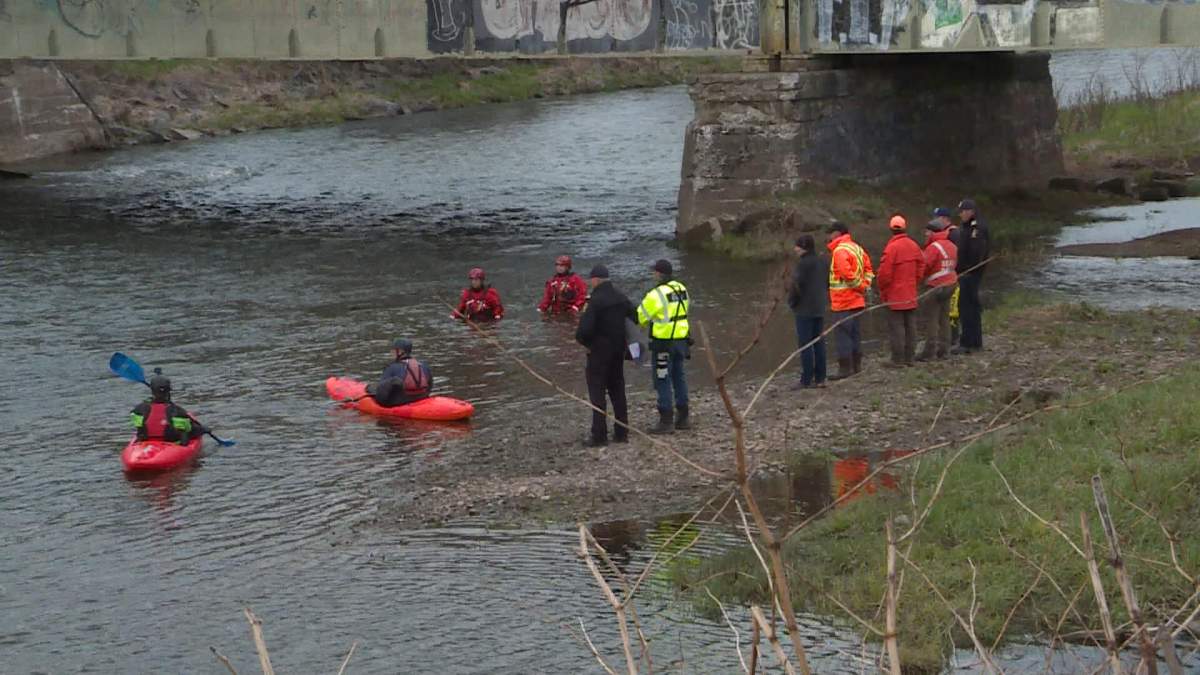 Search and rescue crews launch a mannequin in the Salmon river on May 13, to track it's movements with the current.