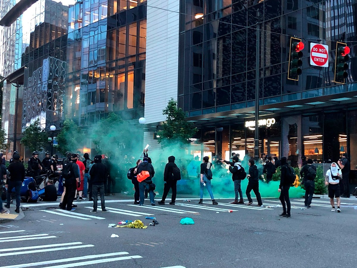 In this May 29, 2020, photo, demonstrators gather at 5th Avenue and Madison Street during a march in solidarity with Minneapolis and protesting police brutality in Seattle. Protests have been erupting all over the country after George Floyd died earlier this week in police custody in Minneapolis. 