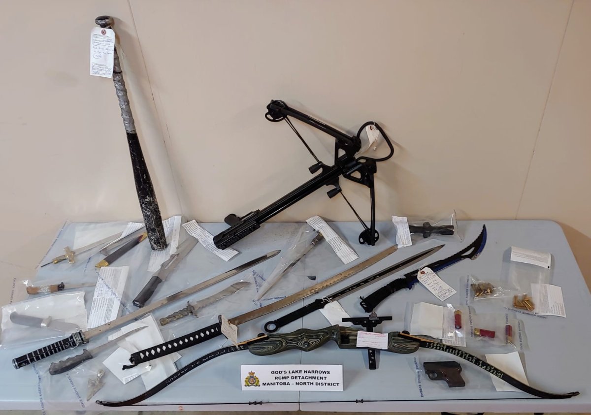 RCMP say they found drugs and weapons during a raid at a home in God's Lake Narrows Saturday.