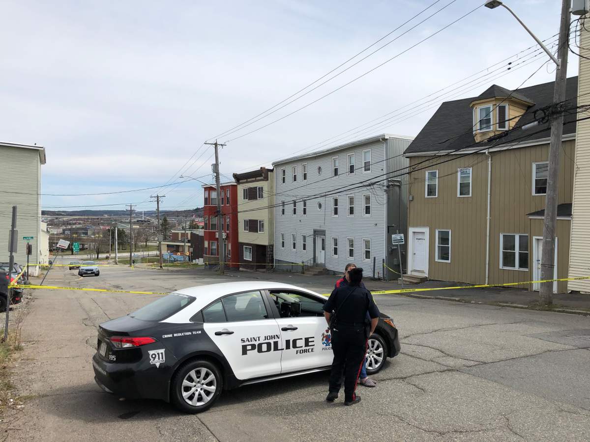 Police tape surrounds the scene of a shooting on Waterloo Street in Saint John, N.B., on May 3, 2020.