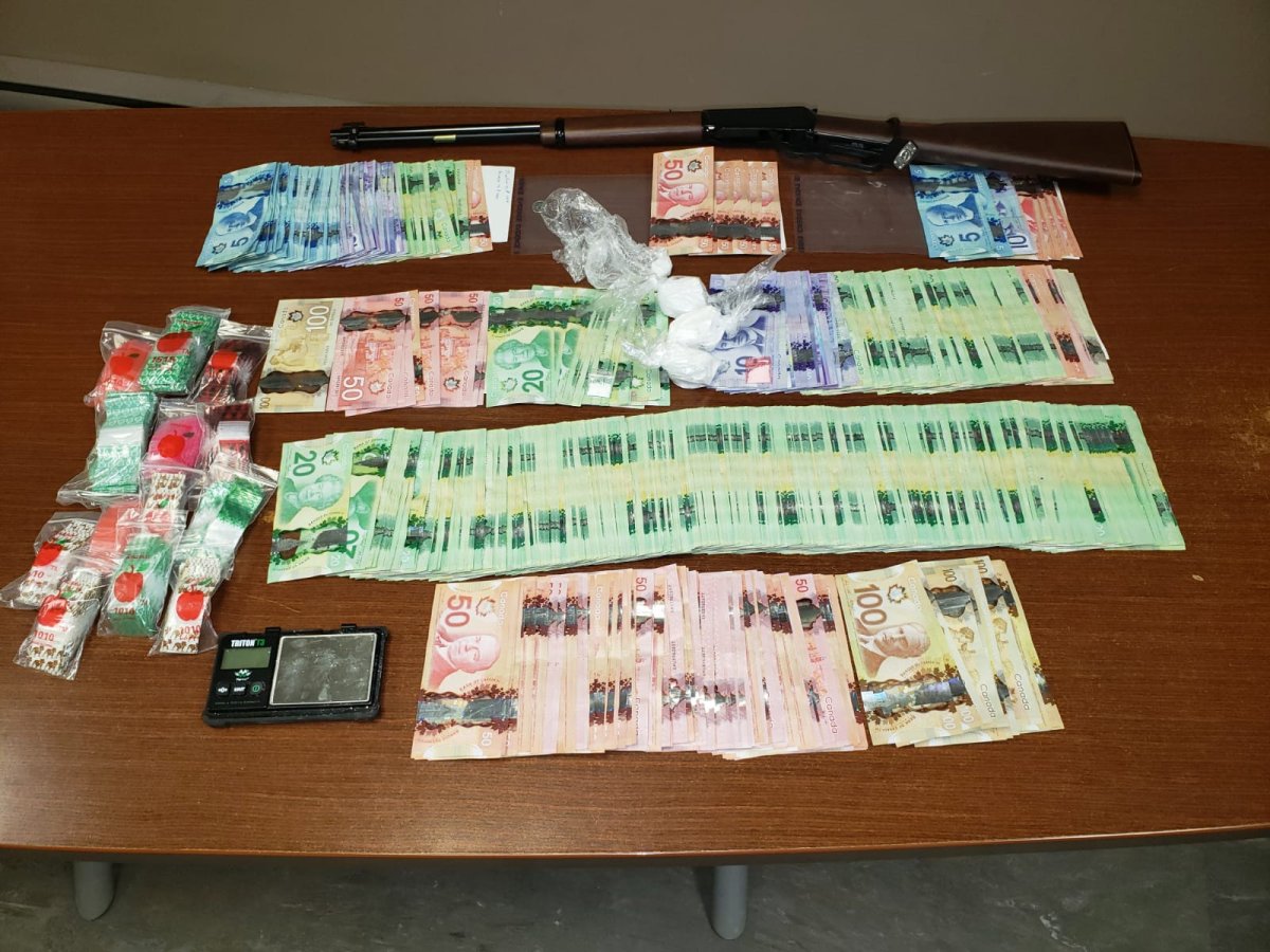 Police say they found cash, cocaine, and a firearm during a raid at a home on Ebb and Flow First Nation Friday.
