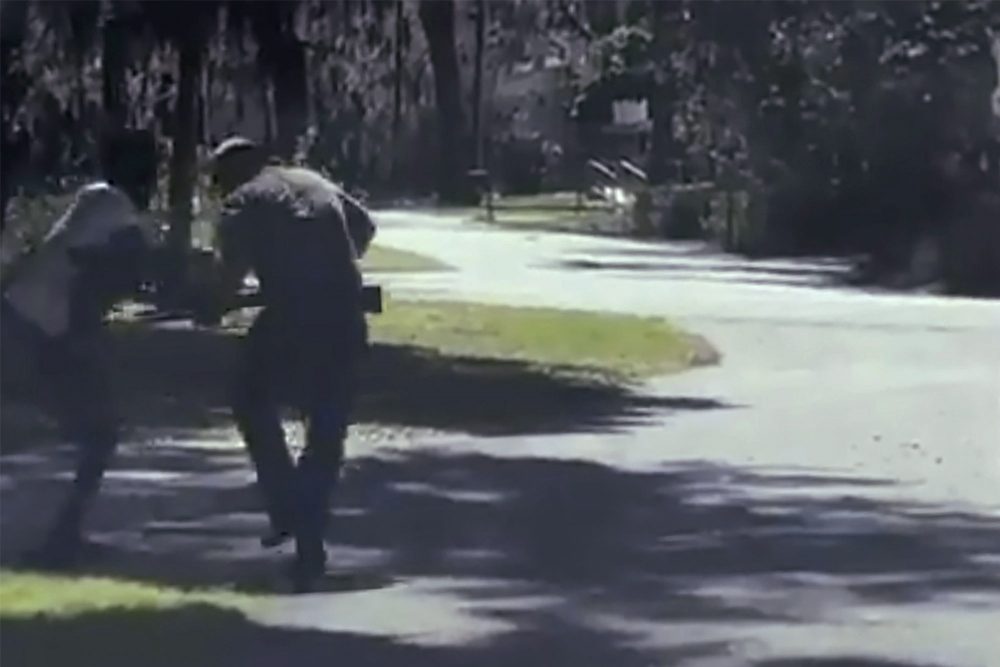 In this image from video posted on Twitter on Tuesday, May 5, 2020, Ahmaud Arbery, left, struggles with a man over a shotgun on a street in a neighbourhood outside Brunswick, Ga., on Feb. 23, 2020.