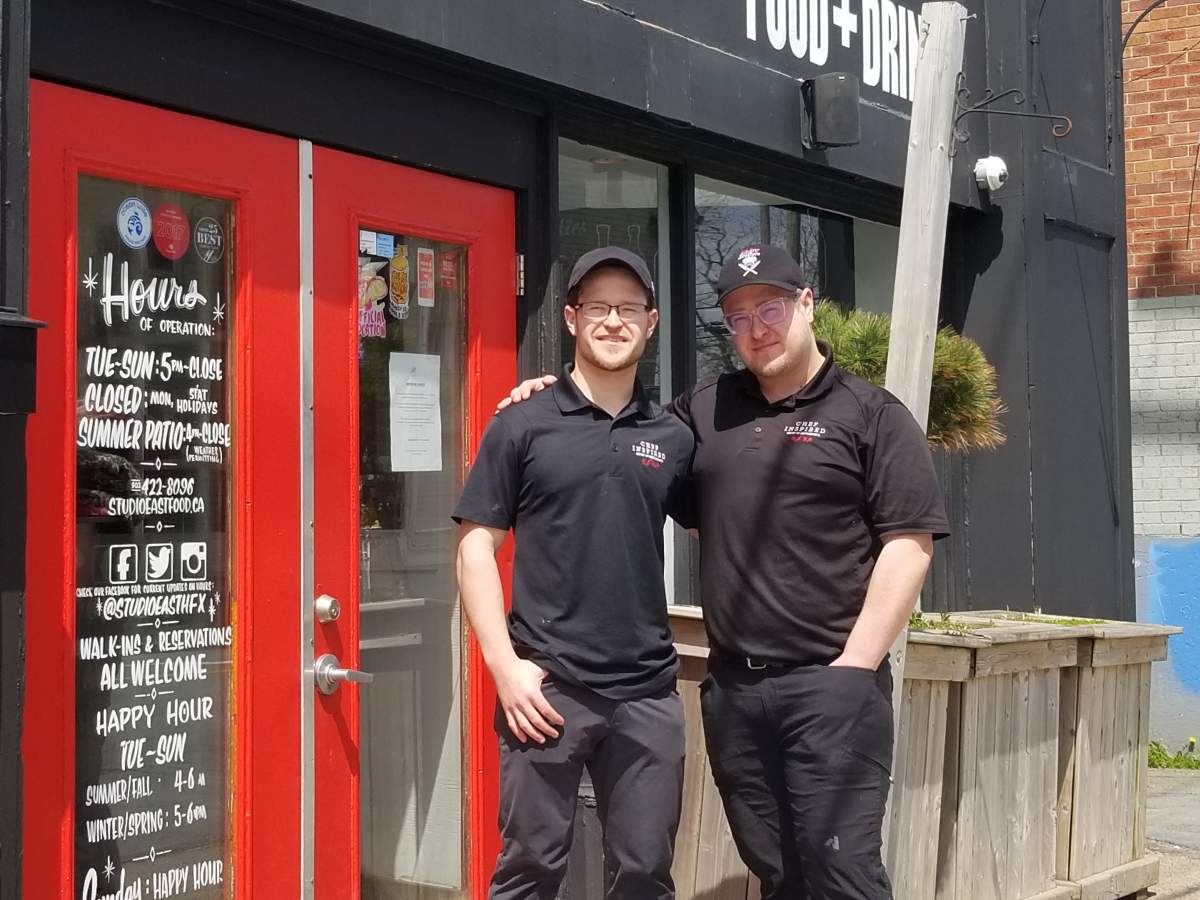 Studio East co-owners André and Guy Pratt stand outside their restaurant on Cunard Street on May 15, 2020.
