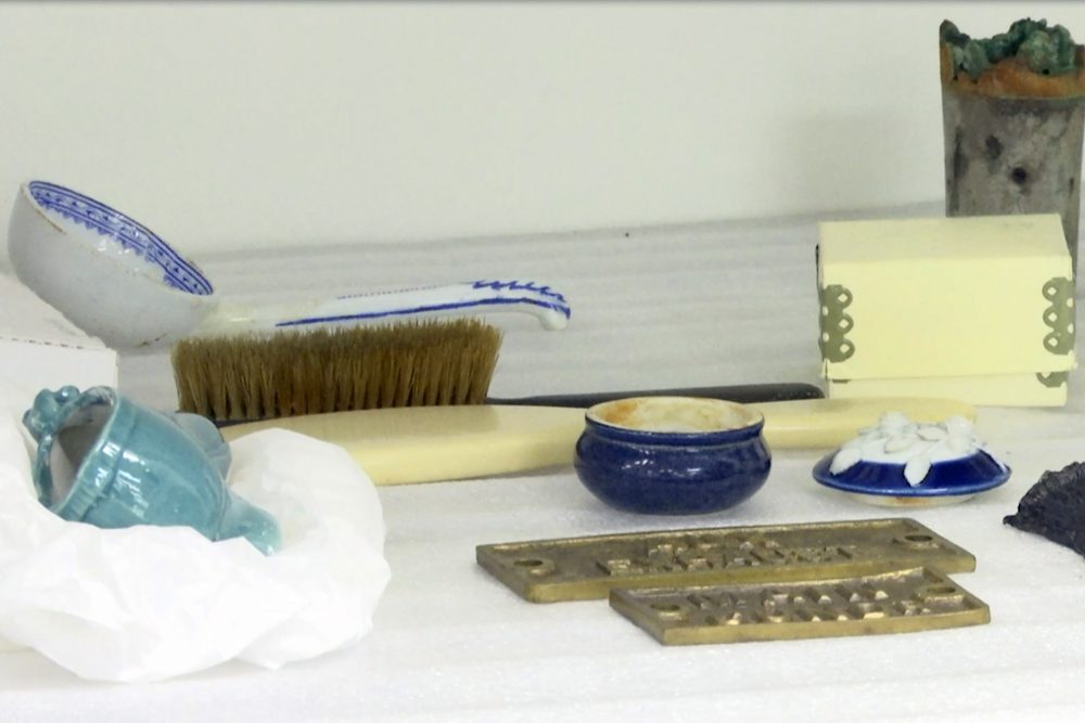 In this Feb. 18, 2020 file photo, personal effects recovered from the Titanic sit on shelves at a storage facility in Atlanta, Ga.