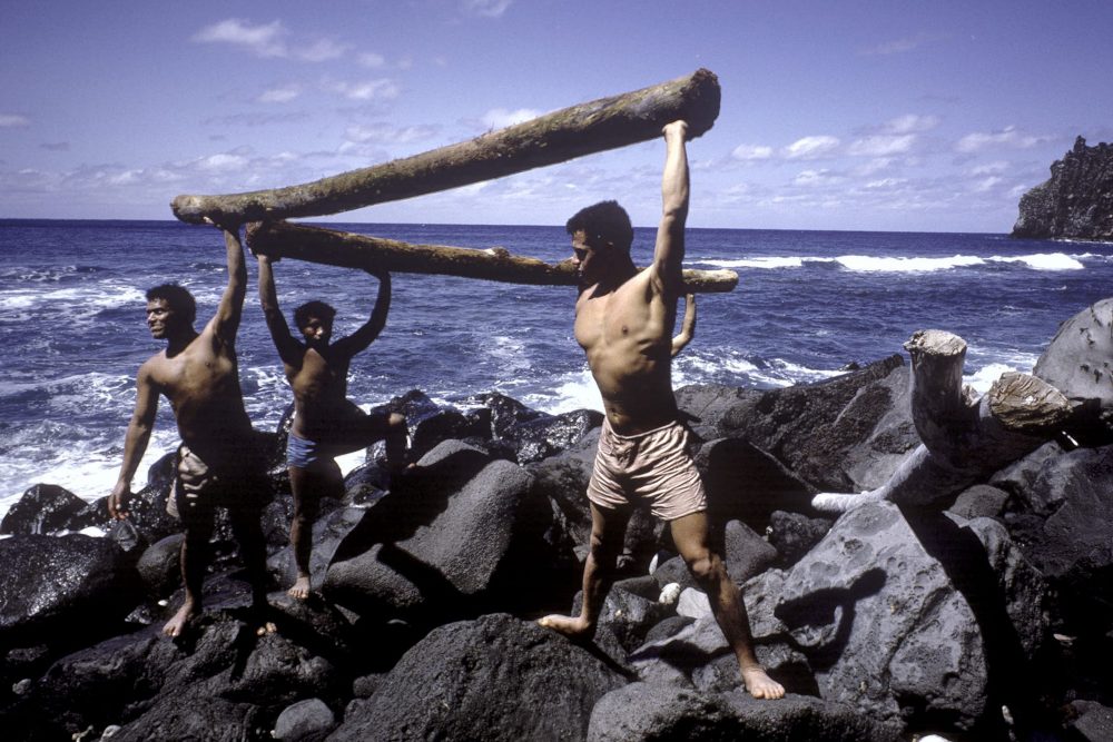 A group of teenagers re-enact their castaway lifestyle on 'Ata in Tonga in 1966.