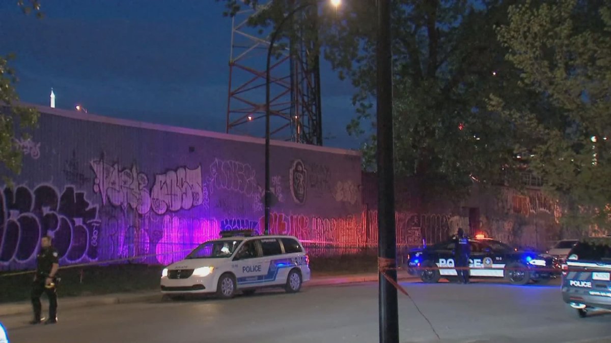 Montreal police officers respond to a suspected incident of arson at a cellphone tower in the city's Sud-Ouest borough early the morning of May 25, 2020.