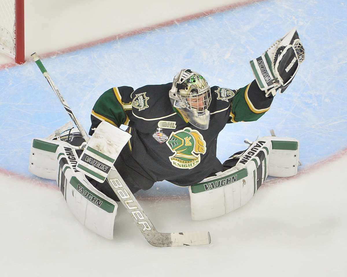 Red Deer, Alta. - Tyler Parsons of the London Knights makes a glove save during the 2016 Memorial Cup tournament.