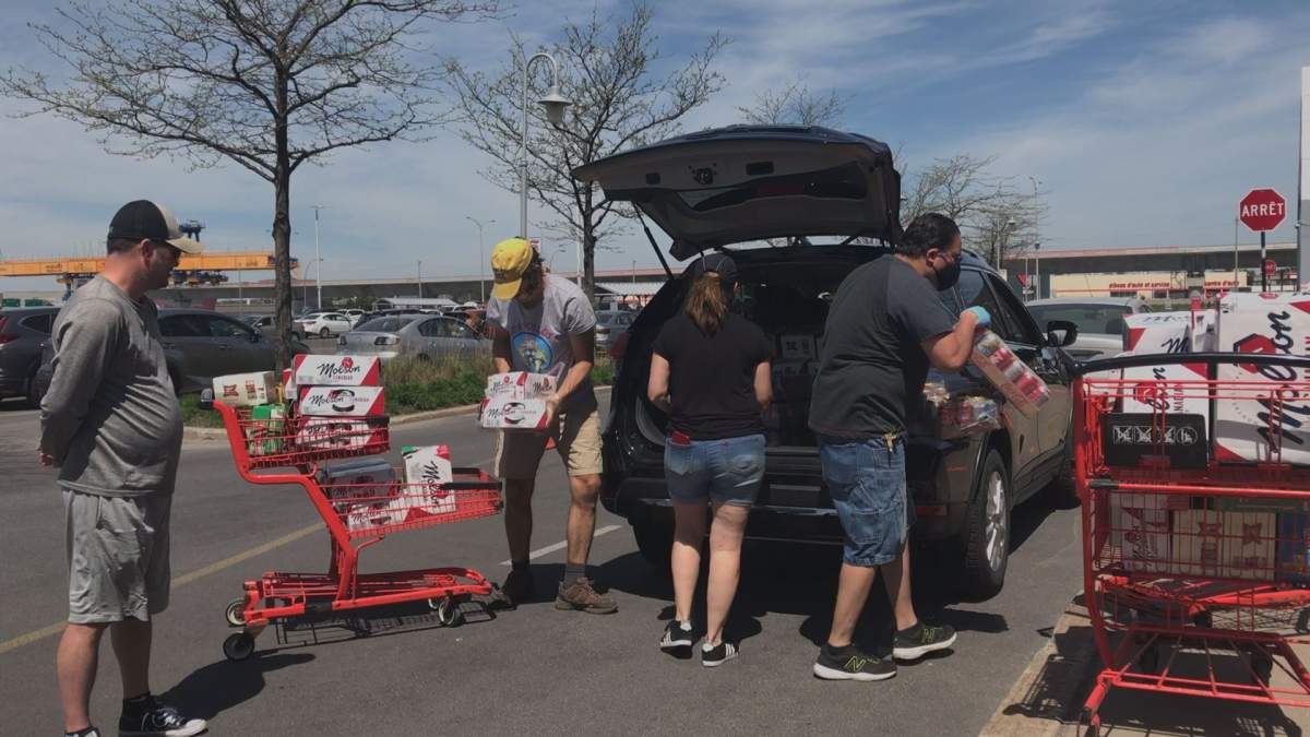 Mike Lecours drops off his refundable cans and bottles at Provigo Kirkland on May 24, 2020.